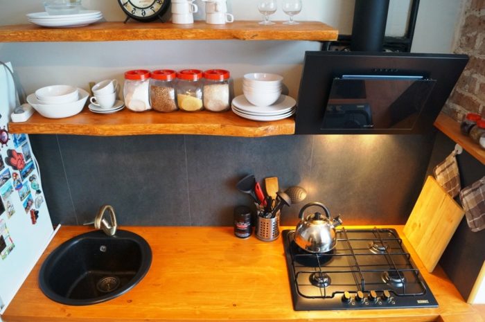 60x60 tile on the backsplash of a small kitchen