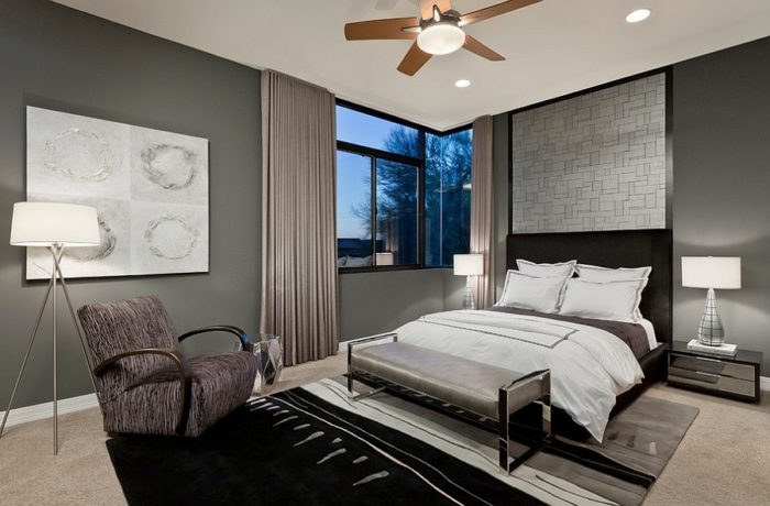 a bedroom with gray walls