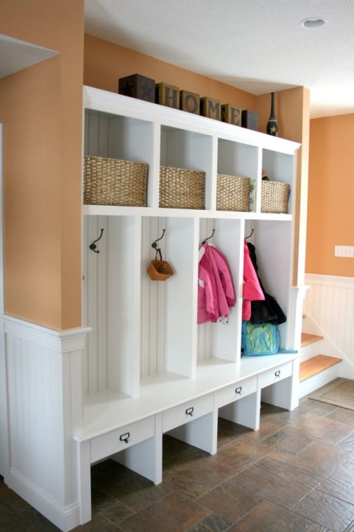 a closet with a shoe rack and open sections