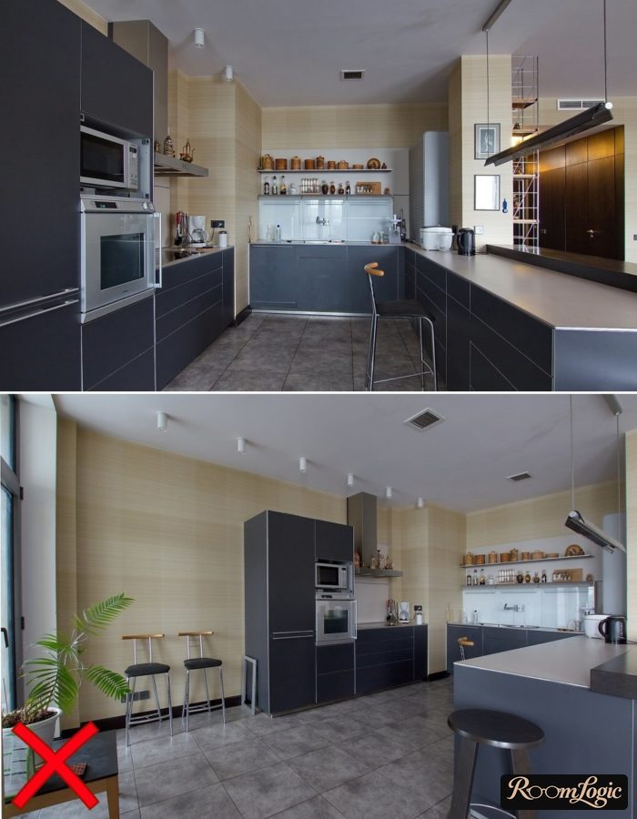 a gray kitchen with beige wallpaper