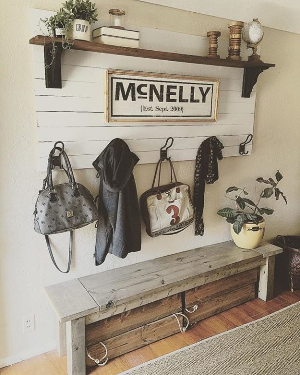 a homemade wooden bench in the entryway