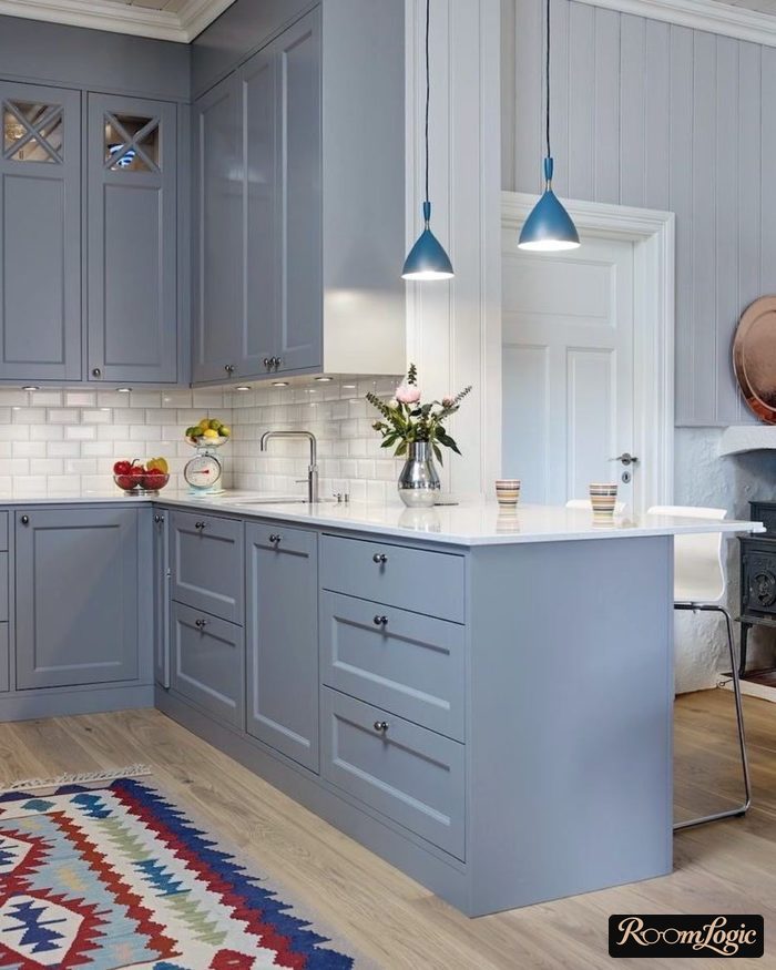 A light gray-blue kitchen in a neoclassical style