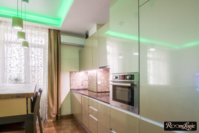 a plain curtain and patterned sheer curtain in the kitchen