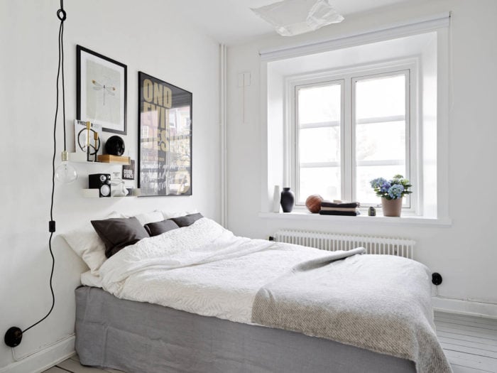 a small beige minimalist bedroom