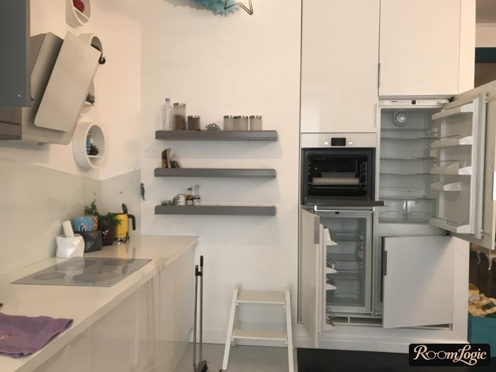a standalone tech station in a kitchen without upper cabinets