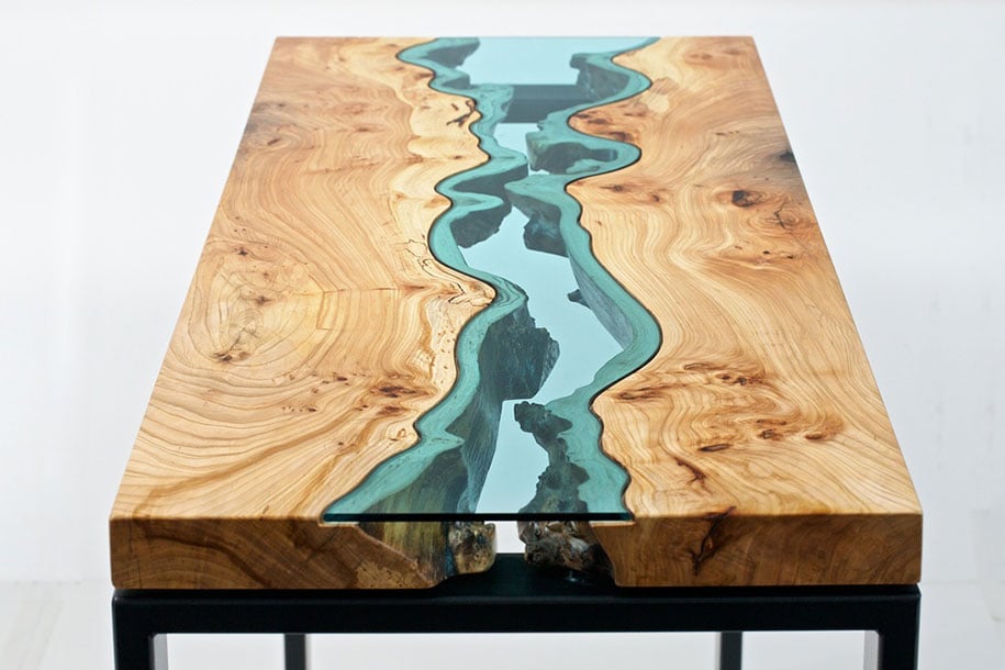 a wooden coffee table with cast glass