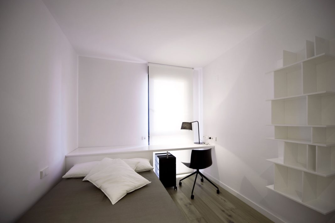 a workspace on a small minimalist bedroom