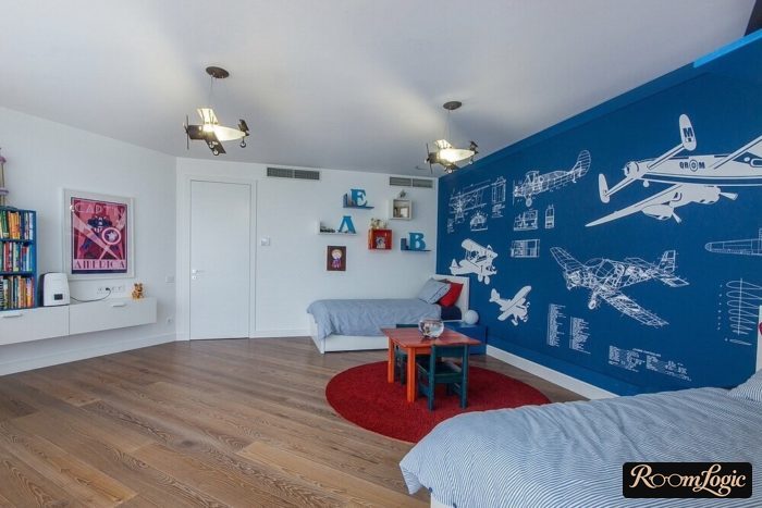 Airplane drawings on wallpaper in a boy's room