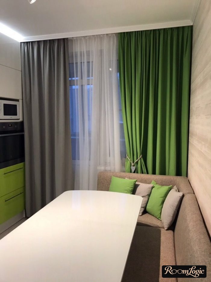 asymmetric gray and green curtains in the kitchen