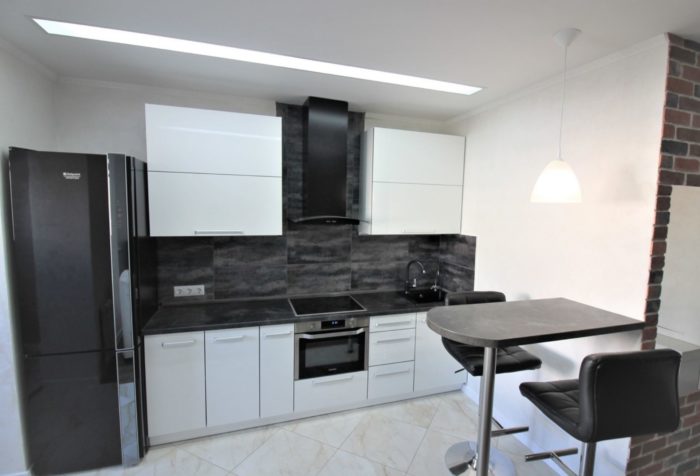backsplash extending to the adjacent kitchen wall