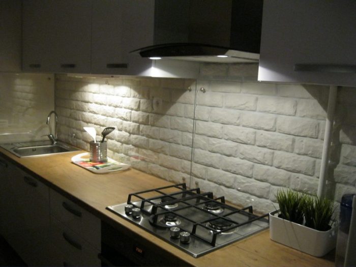 backsplash of decorative brick with lighting