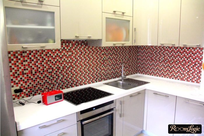 backsplash of red mosaic in the interior of a small kitchen
