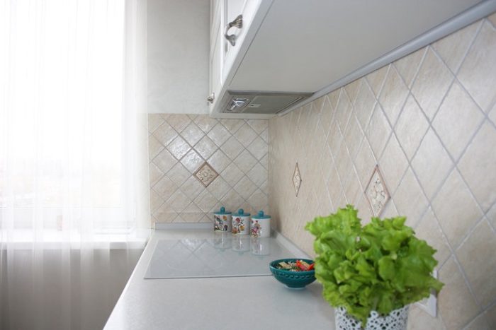 backsplash of small square tile in diamond pattern