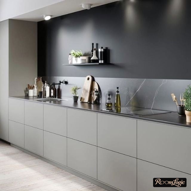 backsplash of stone and black paint transition on the kitchen wall without an upper row