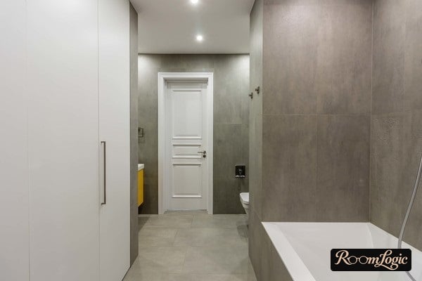 Bathroom clad in one type of gray tile