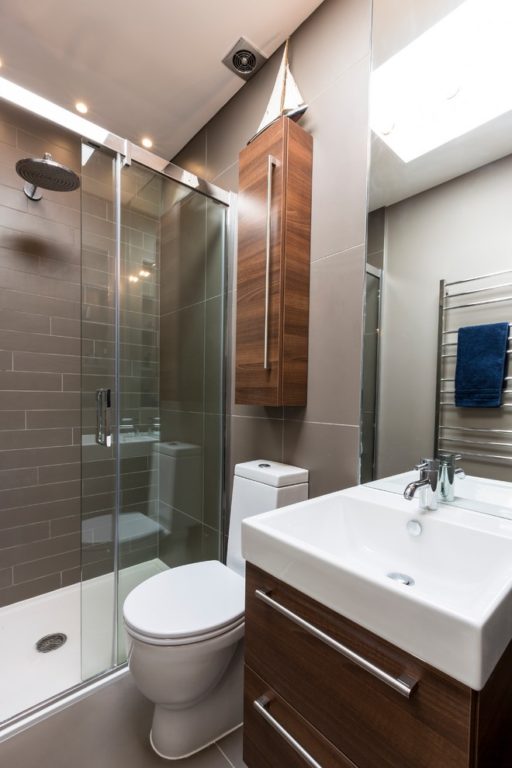 bathroom design with glass shower curtain