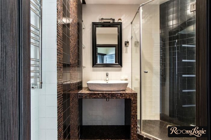 bathroom design with sink on countertop and shower