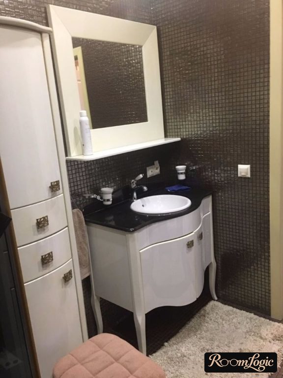 Bathroom in a classic style with black tile