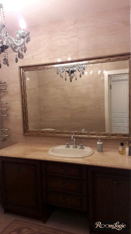 bathroom in an imperial style with a chandelier