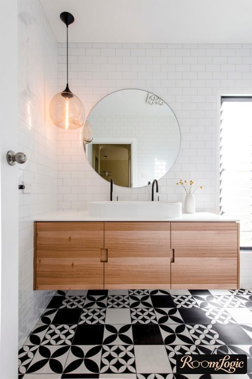 Bathroom in Scandinavian style with black-and-white tiled floor with a pattern