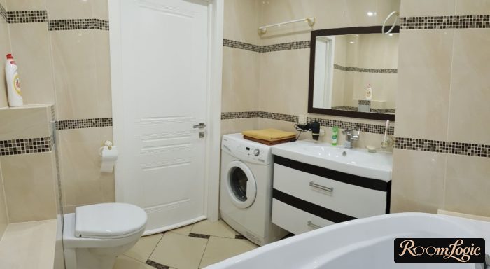 bathroom with a washer