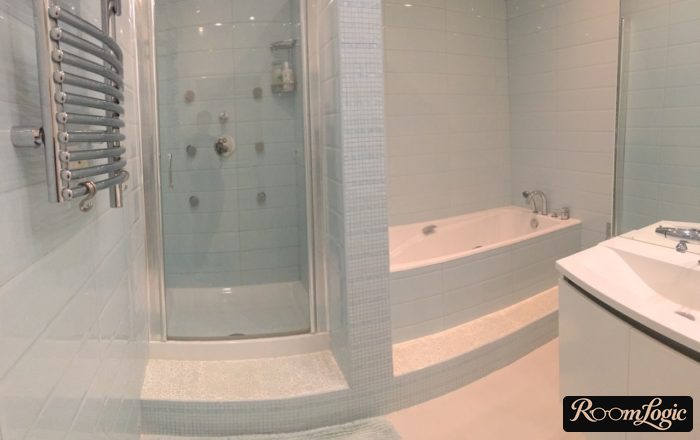 bathroom with shower and bathtub