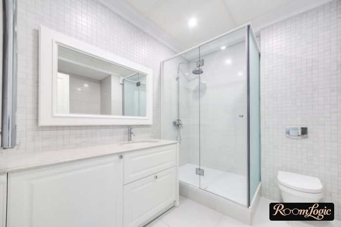 bathroom with shower and beige tile in squares