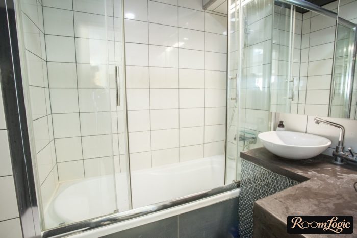 bathroom with small glass shower curtain