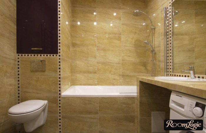 bathroom with toilet and washer in a monolithic design