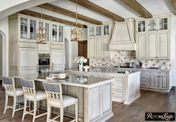 beams and an island in a Provence-style kitchen-dining room