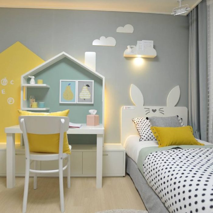 bed and desk in kids’ room