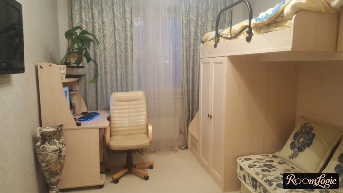 bed loft above sofa in teenager's room