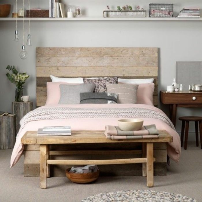 bed made of planks in a small bedroom