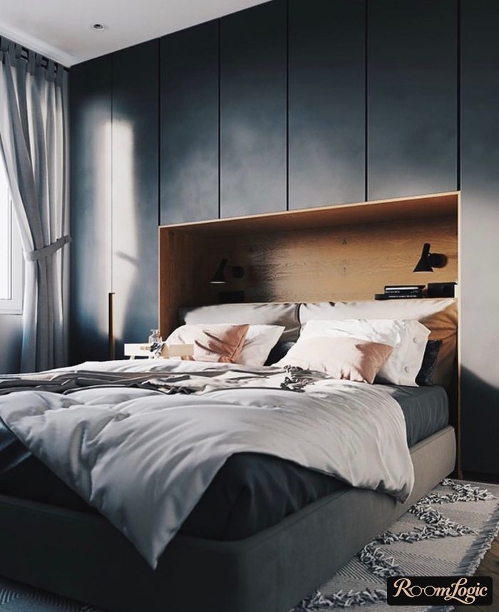 bed surrounded by a closet in a small bedroom