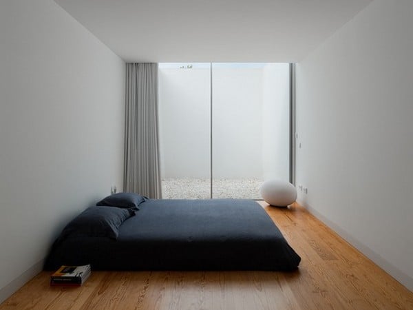 bedroom in minimalism style with mattress instead of bed