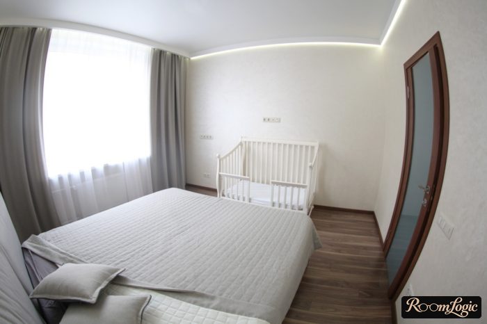 bedroom with a toddler bed under the main bed