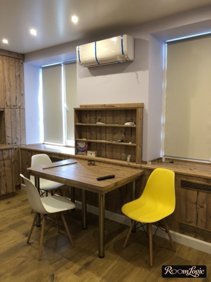 Beige roller shades in the kitchen interior