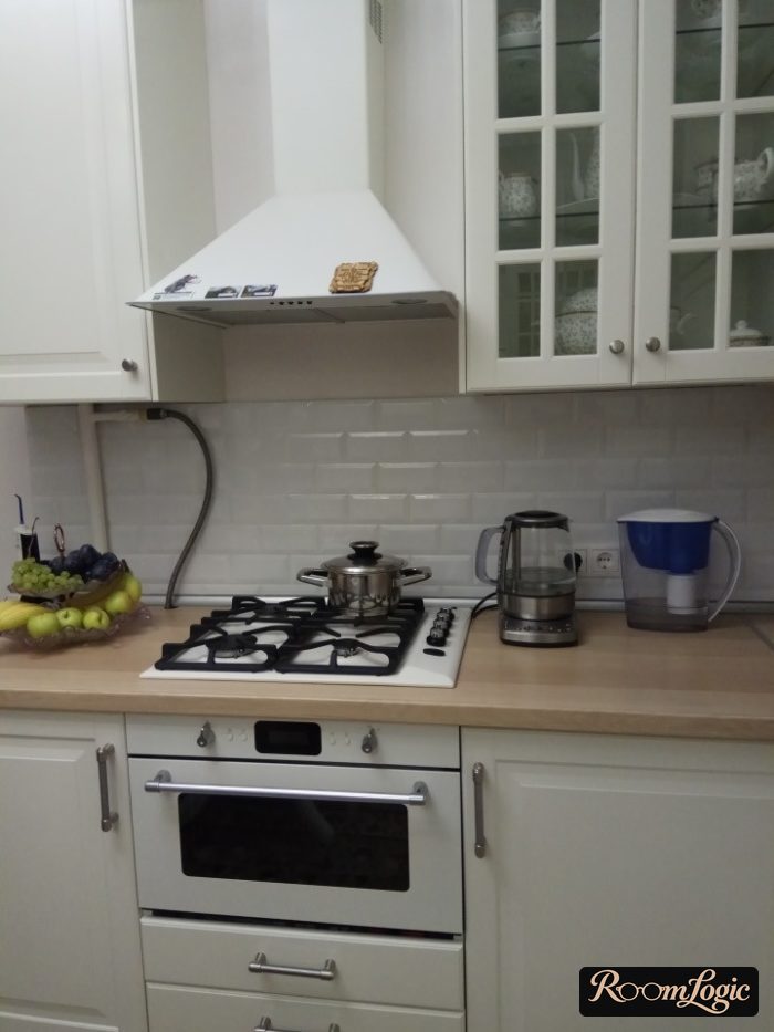 Beige Scandinavian kitchen with wooden countertop