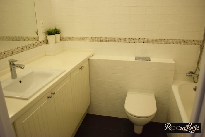 Beige tile in a small bathroom