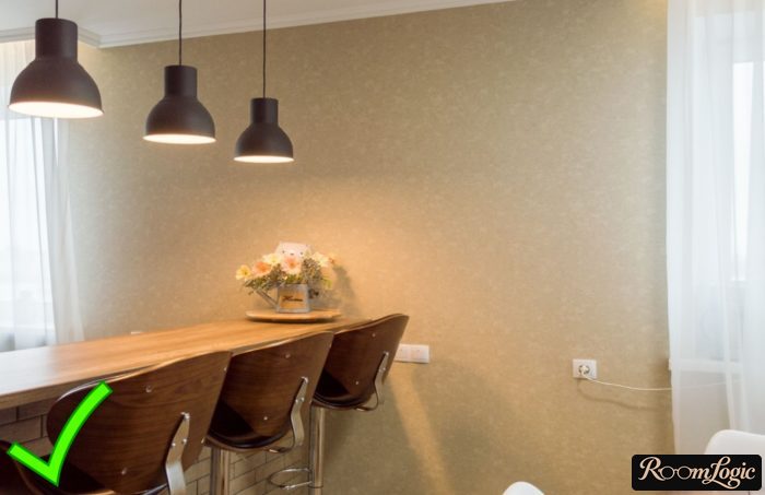 Beige wallpaper in the kitchen-living room with a breakfast bar