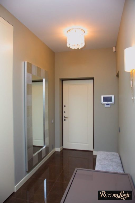 bench and mirror in a small entryway