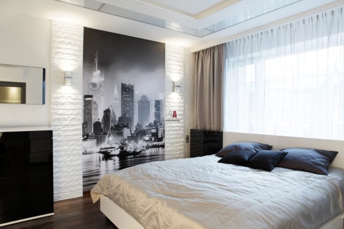 black and white city photo print in bedroom
