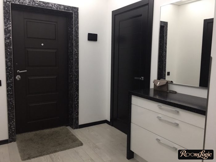 black and white entryway with gray rug