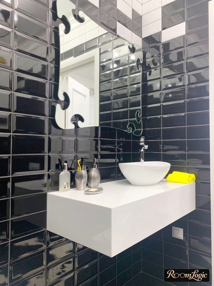 black bathroom with yellow accent