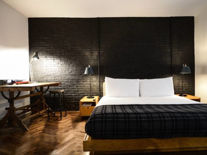 black bricks behind the bed in the bedroom