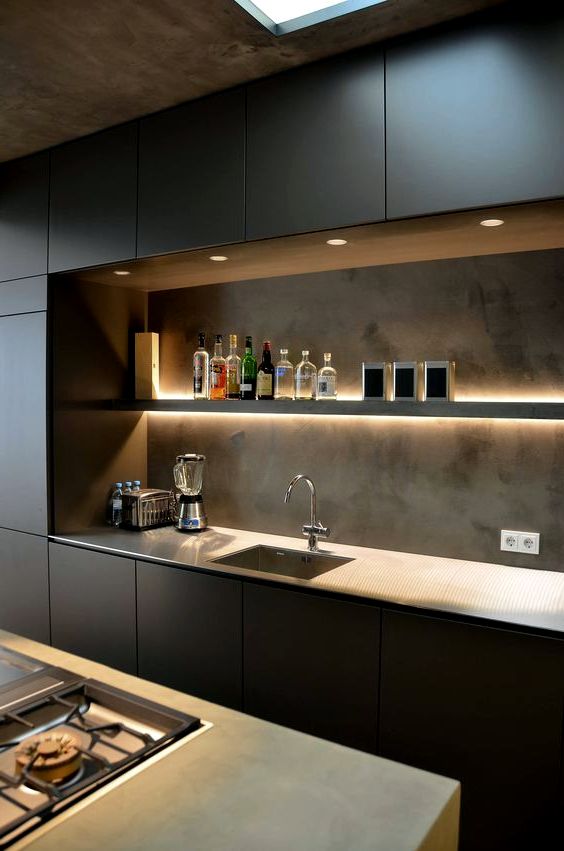 black cabinet fronts and concrete-look backsplash kitchen design