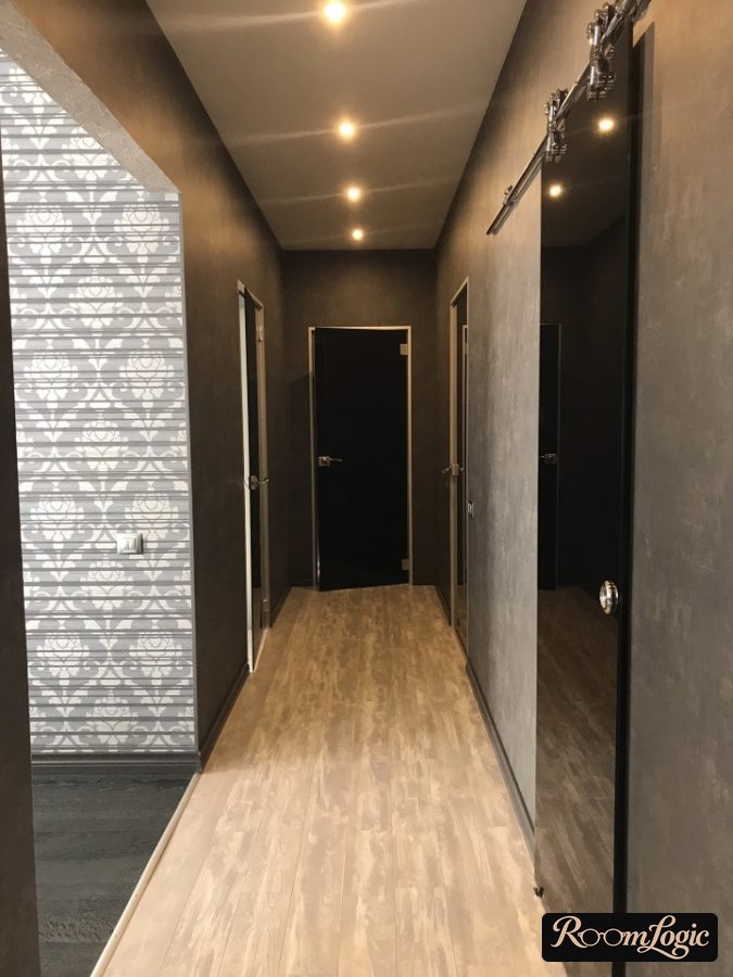 black decorative plaster on the walls in the hallway