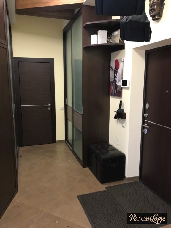black furniture in the interior of a small entryway