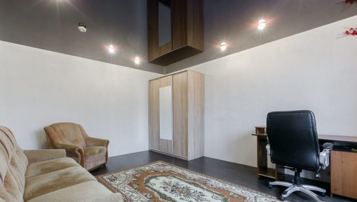 black glossy stretch ceiling in apartment