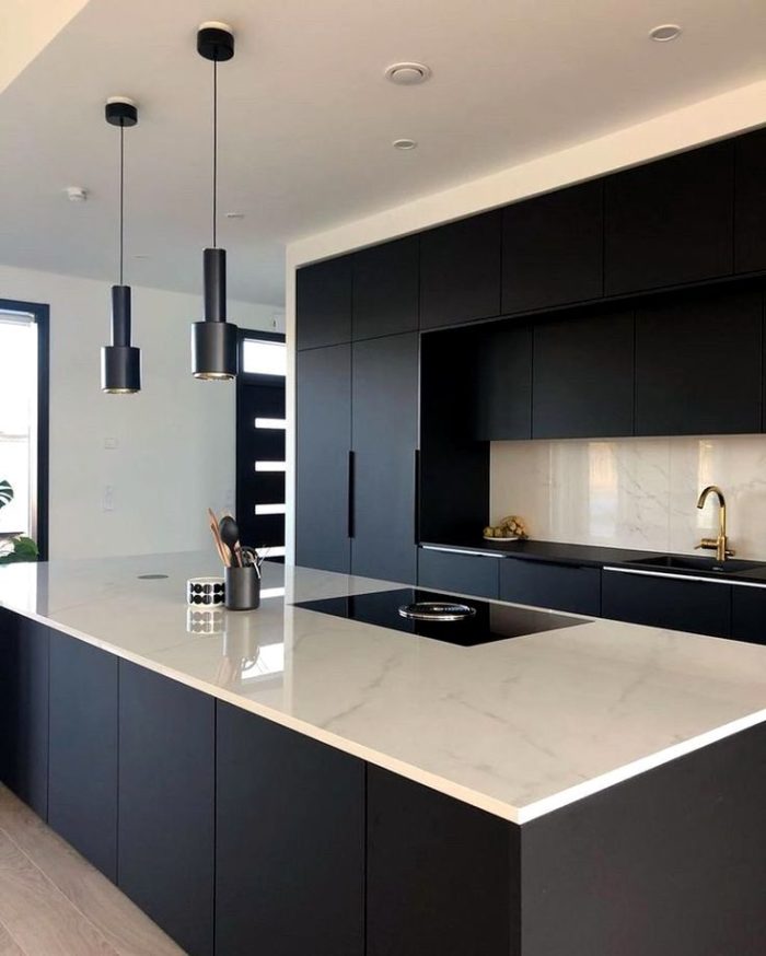 black kitchen design with marble-look countertop